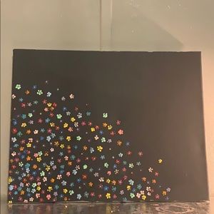 black canvas painting with flowers